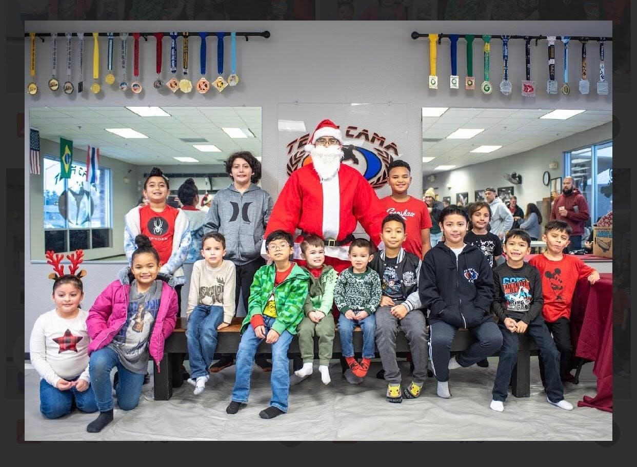 Team Cama Christmas party with the kids