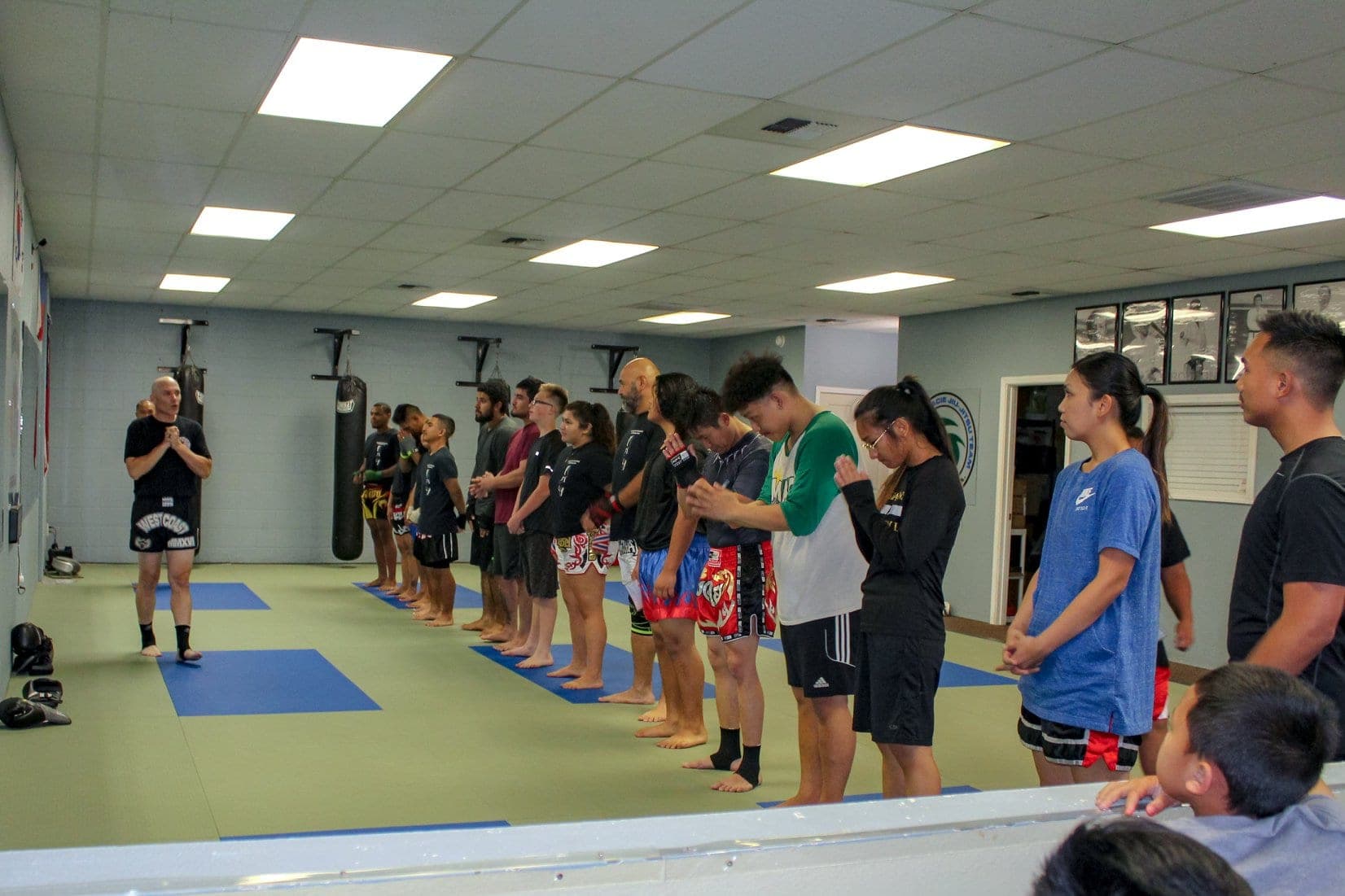 Muay Thai class lined up on the mats